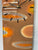 Narrow Orange Brown and Ivory Abstract Resin Wall Clock